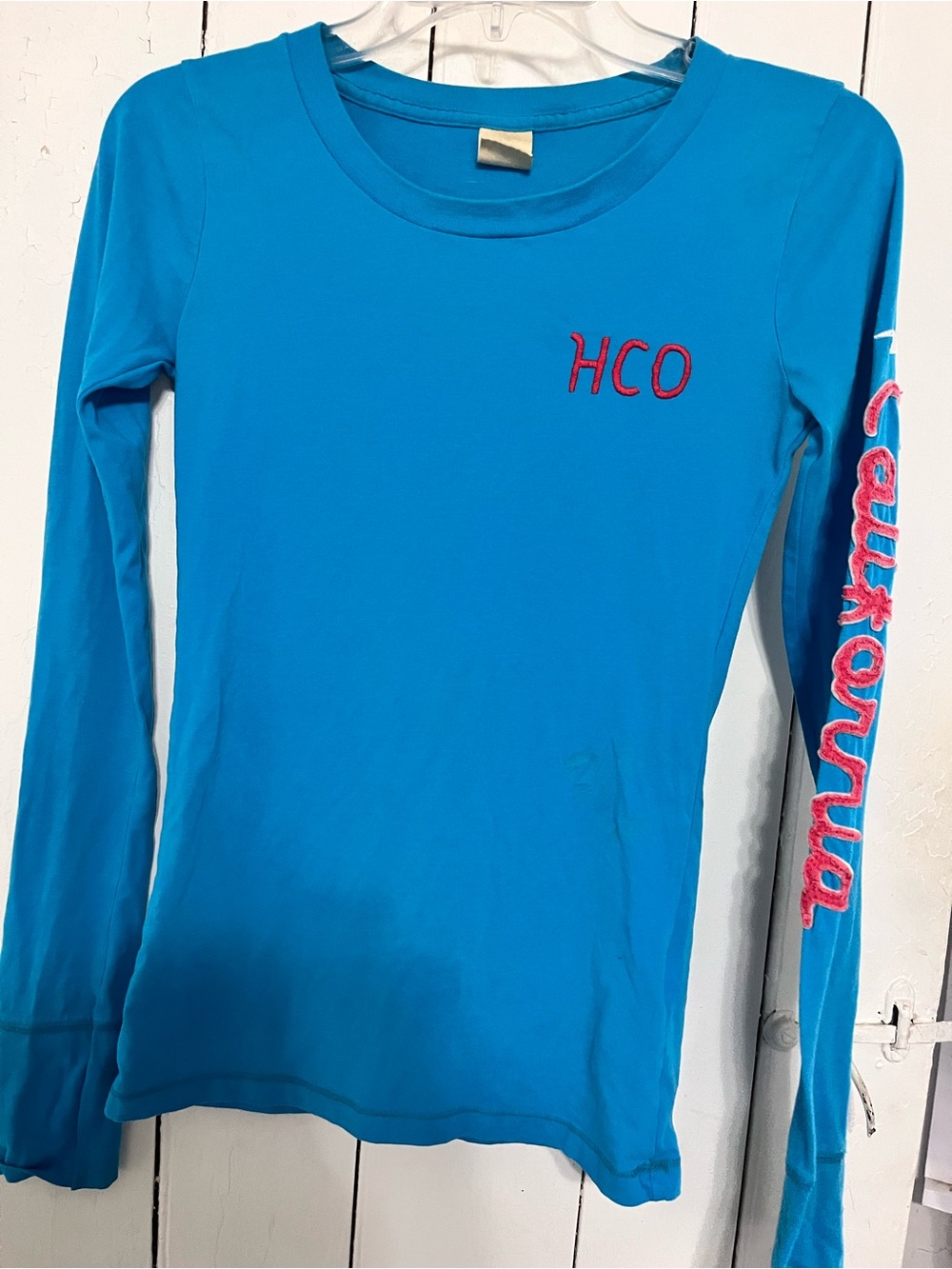 Hollister Bright Turquoise Long-Sleeve Tee with Pink Embroidery